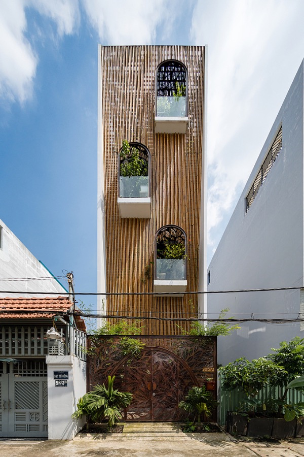 Saigon tube house wears bamboo facade